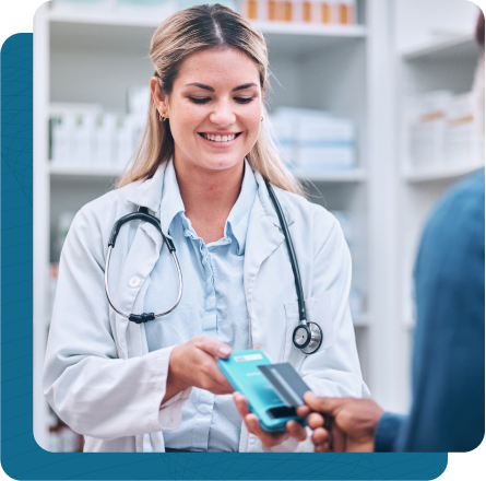 Young female pharmacist assisting patient with tap to pay using credit card.