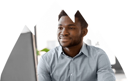 Male worker looking at desktop computer.