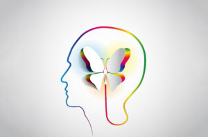 shape of a head and neck outline in rainbow colors with a 3 dimensional butterfly in the middle also outlined in rainbow colors